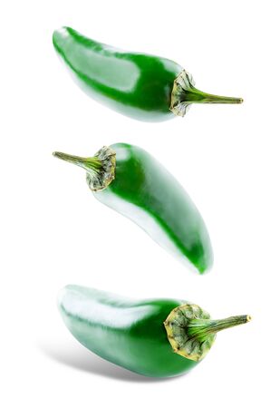 Fresh jalapeno peppers on a white background.の写真素材