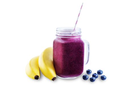 Blueberry banana smoothie on a white background. toning. selective Focusの写真素材