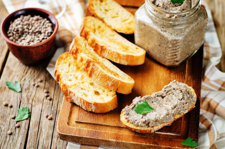Lentil black bean mushroom pate with glasses of wine. toning. selective focus