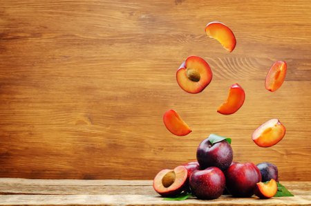 Plums with flying slices.の写真素材