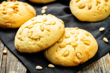 Italian pine nuts cookies with glasses of milk. toning. selective focus