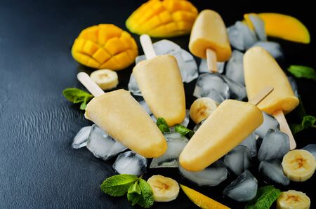 Banana mango ice cream with fruits and iceの写真素材