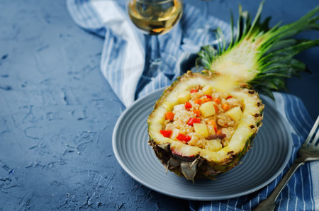 Bacon chicken pine apple vegetables fried rice in pineapples. toning. selective focusの写真素材