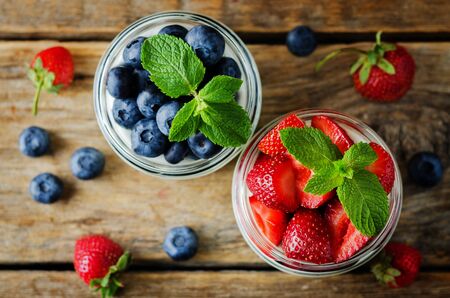 Greek yogurt strawberry and blueberry parfaits with fresh berries. toning. selective focusの写真素材
