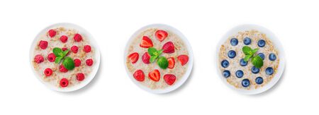 Oatmeal porridge with milk and fresh on a white isolated background. toning. selective focusの写真素材