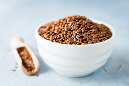 flax seed in white bowl. toning. selective focusの写真素材