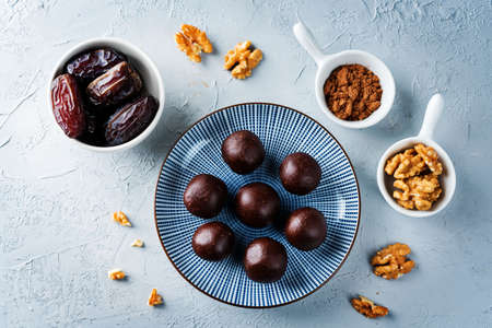 Dates walnuts chocolate raw balls. toning. selective focusの写真素材