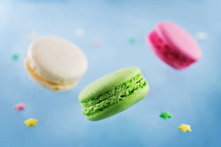 Flying multicolored macarons. toning. selective focusの写真素材