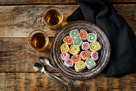Turkish delight, Oriental sweetness on a plate with tea. toning. selective focusの写真素材