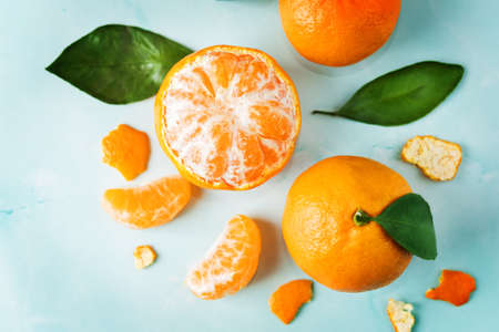 Tangerine fruit with slices, peel and leaves. tinting. selective focusの写真素材