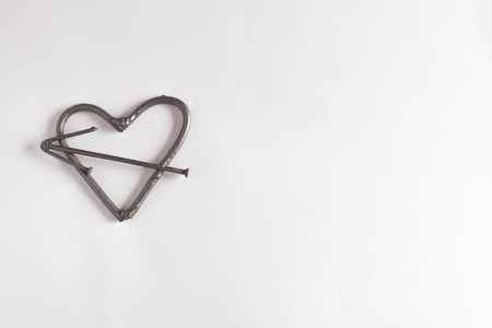 heart with nails. Fathers day concept. Valentines day background with text space iron heart of nails. male brutal heartの写真素材