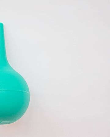 medical enema on a white background. Medicine concept. Top view. Mock up. Flat lay compositionの写真素材