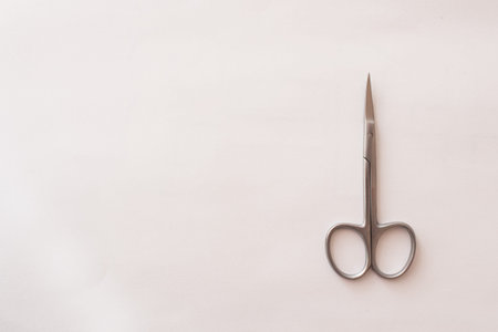 manicure scissors on a white background. minimalism concept. Mock up, space text.