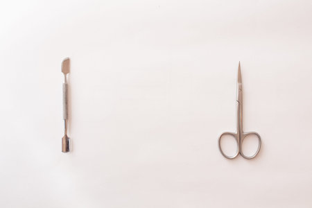 set of tools for manicure on a white background close-up. top view, text space