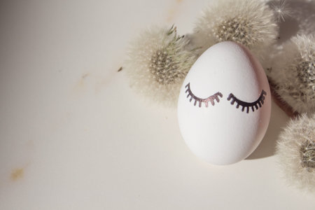 Easter eggs on white marble background in the shadow of a tropical palm tree with copyspace. set...