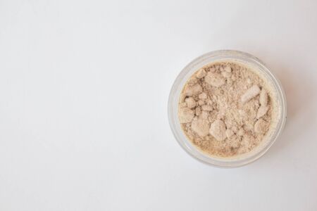 Texture of makeup powder - blush or eyeshadow. Mineral make-up cosmetics close-up isolated on white background.の写真素材