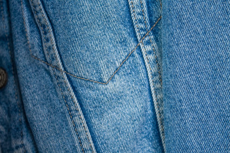  Jeans and denim jacket close-up in blue with straight seams. Wardrobe Update. Top view. Flat lay...