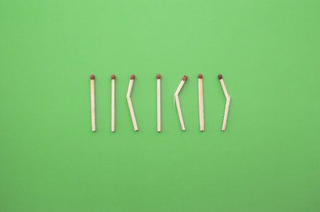 Conceptual figures from matches on a bright background. Downtime and minimal art object. Not like everyone else, different from the crowdの写真素材