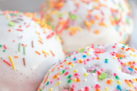 A set of Easter cakes in multi-colored sprinkles. Easter cakes on a festive table with Christian Easter bread.の写真素材