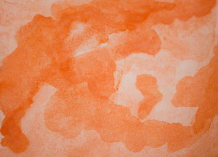 Orange watercolor background. Watercolor splash on paper in the form of abstraction. Orange gradient handmadeの写真素材