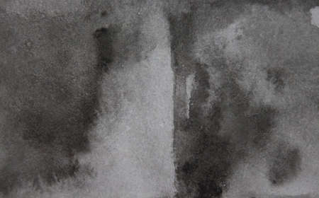 Black background. Old black paper texture with streaks of black and gray paint. Watercolor abstract black background in grunge styleの写真素材