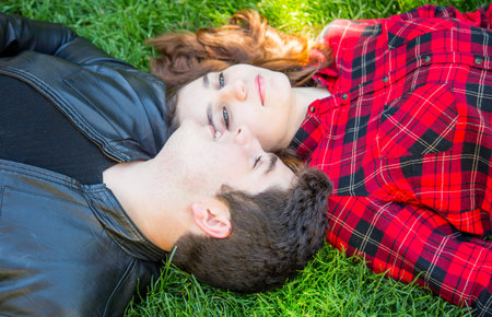 love story, boy and girl on the grass