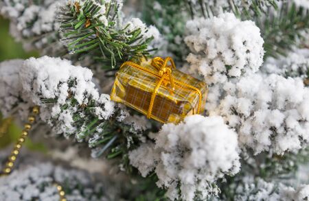New Year's toys and a garland on a Christmas treeの写真素材