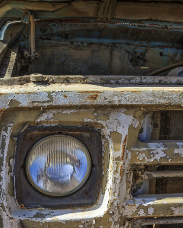 A fragment of an old, rusty carの写真素材