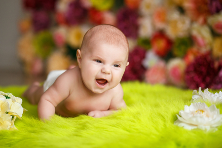 little baby lying down and smilingの写真素材