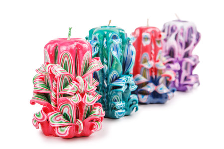 Carved colored candles isolated on white backgroundの写真素材