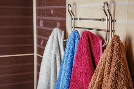 Clean Colored towels hanging on the rack in the bathroom. Selective Focusの写真素材