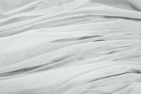 chiffon tulle fabric textured background. pleated skirt fabric texture. closeup plisse fabric texture patternの写真素材