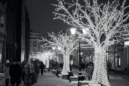 MOSCOW - JANUARY 05, 2017: Beautiful Christmas and New Year decorations in the center of Moscow. Festivities in the evening city. Black and white photographyのeditorial素材
