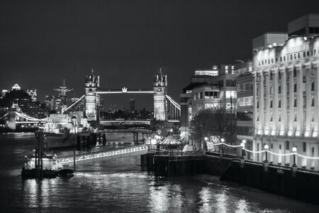 LONDON - NOVEMBER 17, 2016: Tower bridge at night, view from the River Thames. Black and white photographyのeditorial素材