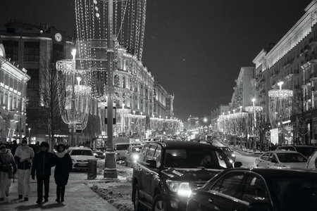 MOSCOW - JANUARY 05, 2017: Beautiful Christmas and New Year decorations in the center of Moscow. Festivities in the evening city. Traffic jam on Tverskaya Street. Black and white photographyのeditorial素材