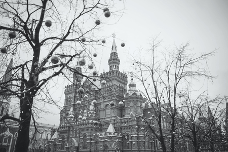 MOSCOW - JANUARY 02, 2017: Christmas decorations on trees on Red Square near the building of the Historical Museum. Christmas and New Year holidays. Black and white photographyのeditorial素材