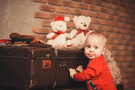 Portrait of a cute little boy. Little boy among Christmas decorationsの写真素材