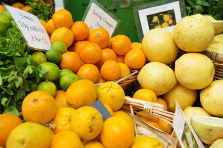 Lemons, limes and juicing oranges on display at Borough Market in London, UKの写真素材