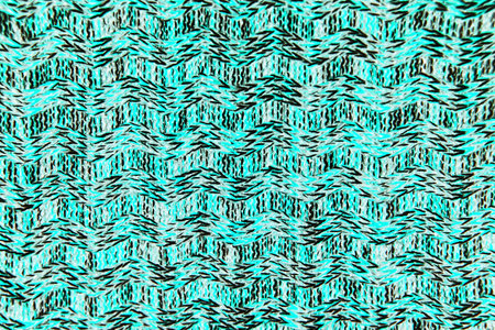 Wool scarf or sweater texture close up. blue Knitted jersey background with a relief pattern. Braids...