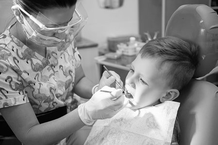 A little boy at a dentist's reception in a dental clinic. Children's dentistry, Pediatric Dentistry....