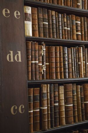 Dublin, Ireland - June 24, 2019: The Long Room interior Of The Old Library At Trinity College. Marble busts of great people and shelves with antique tomesのeditorial素材