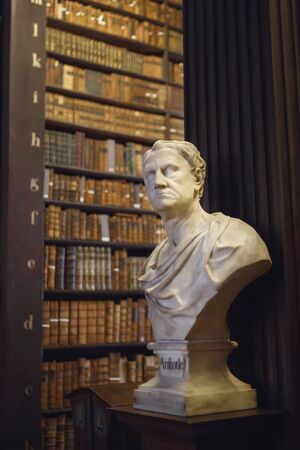 Dublin, Ireland - June 24, 2019: The Long Room interior Of The Old Library At Trinity College. Marble busts of great people and shelves with antique tomesのeditorial素材