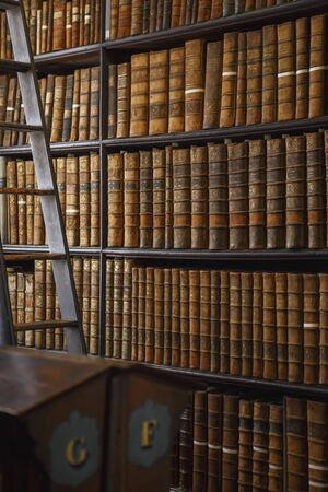 Dublin, Ireland - June 24, 2019: The Long Room interior Of The Old Library At Trinity College. Marble busts of great people and shelves with antique tomesのeditorial素材