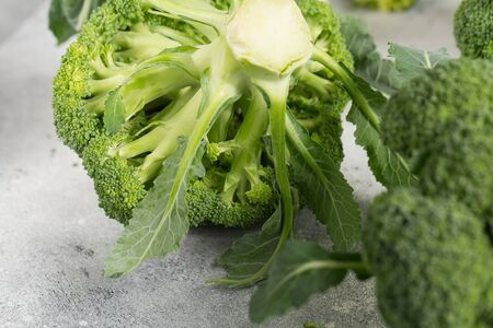 Fresh green broccoli on a light grey background. Macro photo green fresh vegetable broccoli. Green Vegetables for diet and healthy eating. Organic food.の写真素材