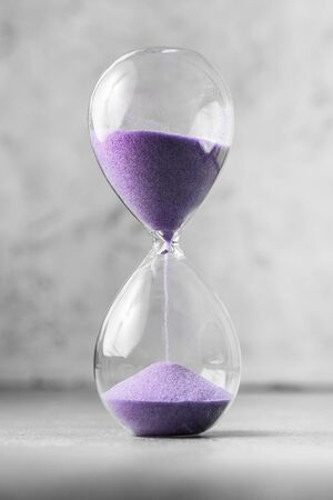 Classic Style Vintage Old Hourglass Sandglass Clock. A sandglass, modern hourglass or egg timer showing the last second or last minute or time out. With copy space.の写真素材