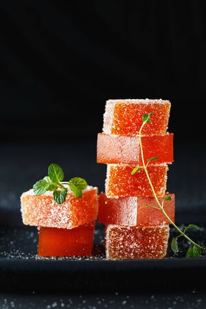 Homemade multicolored marmalade candy in sugar on dark background. Fruit jelly candies. Fruit chewy candy. Jelly Bean. Assortment of colorful fruit jelly candy. Copy space for text.の写真素材