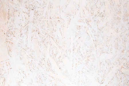 OSB panel texture. Oriented Strand Board. Chipboard building material. OSB wooden panel made of...