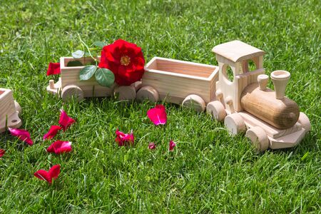 Children's wooden toys. Children wooden train with wagons. Natural wood construction set. Educational equipment. Children's wooden locomotive with various cargo in wagons.の写真素材