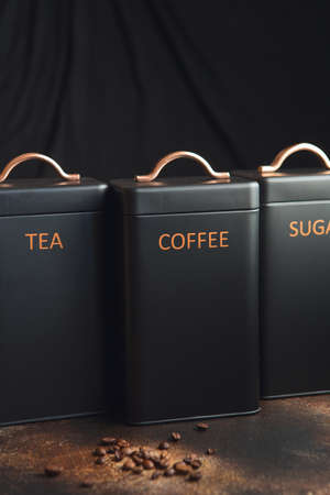 Set of 3 Storage Tins for housing teas, coffee and sugar. Set of three black Storage Jarsの写真素材