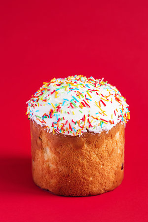 Easter Cake - Russian and Ukrainian Traditional Kulich on a bright red background. Paska Easter...